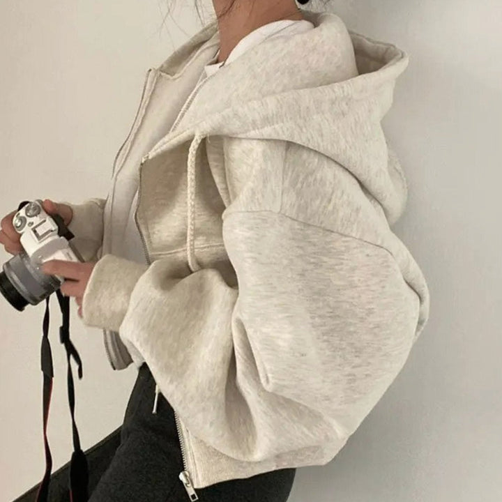 Women's cropped oversized hooded zip-up hoodie with drawstrings and front pockets