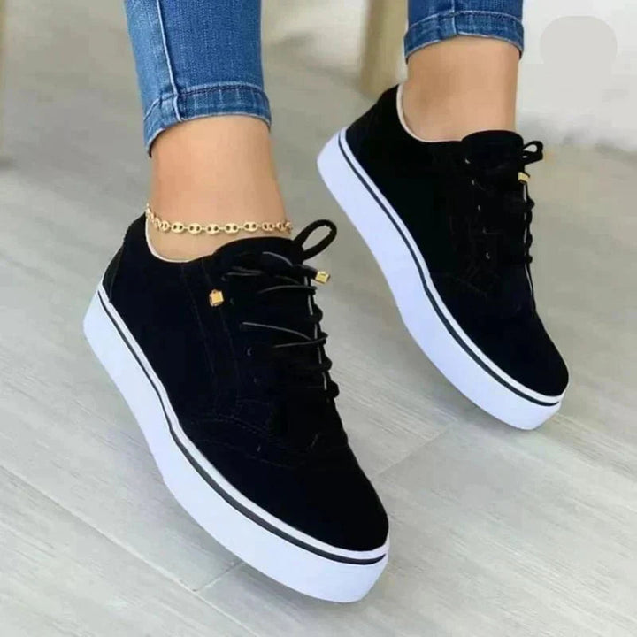 Women's low-top lace-up sneakers with perforated details and platform soles