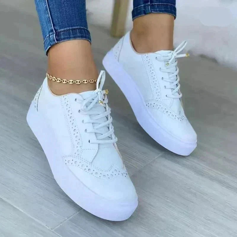 Women's low-top lace-up sneakers with perforated details and platform soles