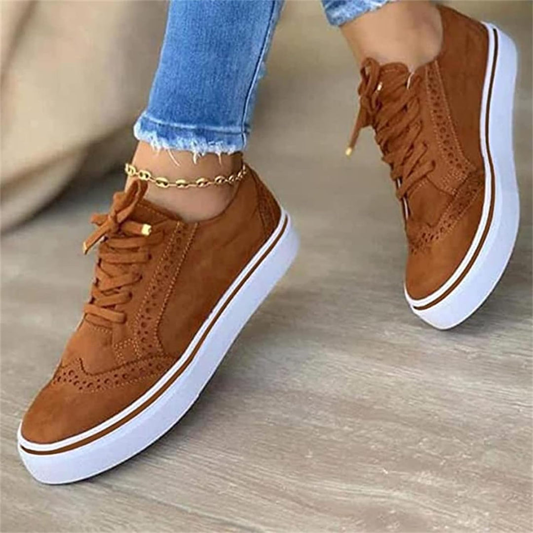 Women's low-top lace-up sneakers with perforated details and platform soles