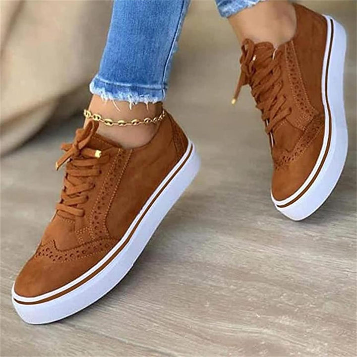 Women's low-top lace-up sneakers with perforated details and platform soles