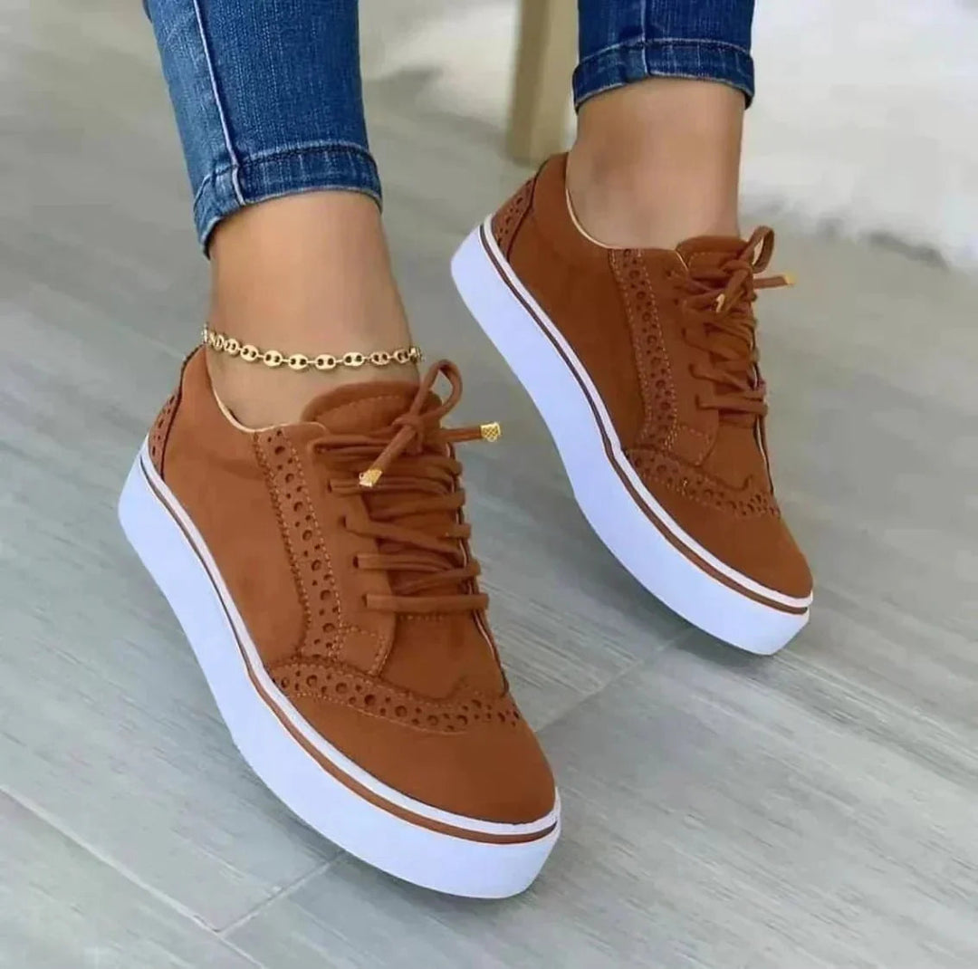Women's low-top lace-up sneakers with perforated details and platform soles