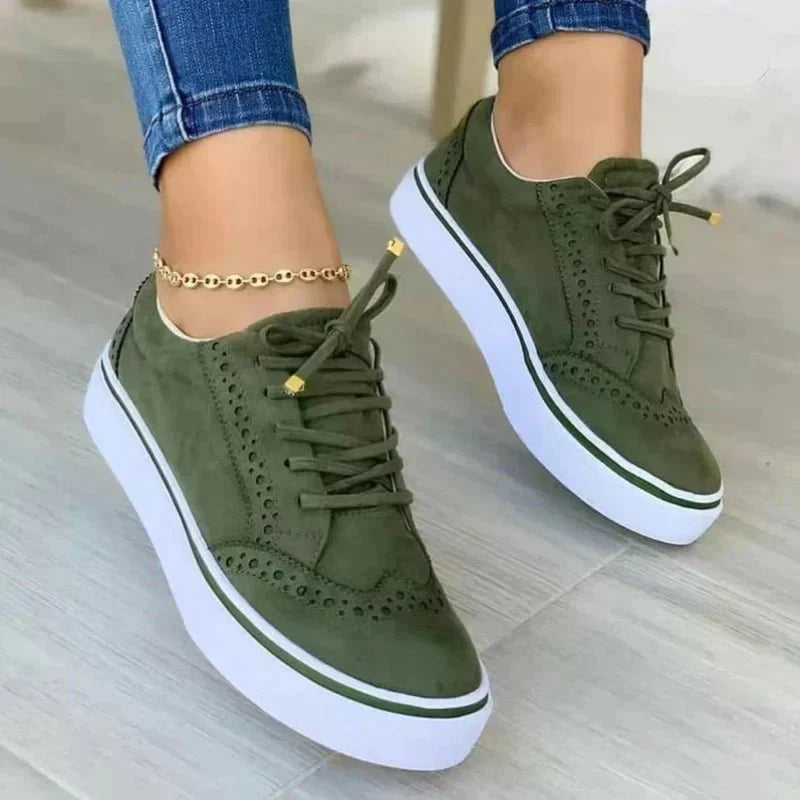 Women's low-top lace-up sneakers with perforated details and platform soles
