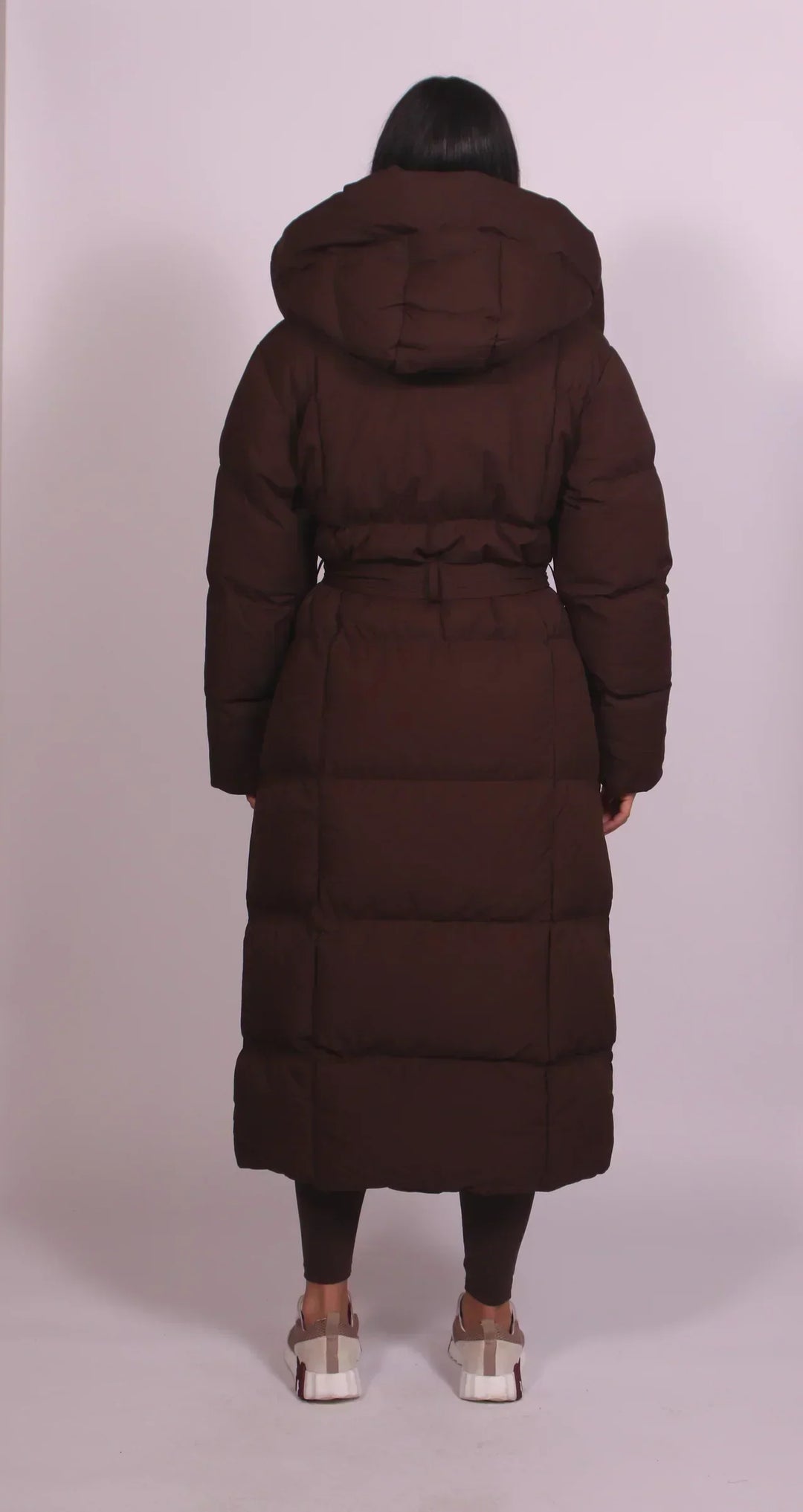 Women's oversized quilted longline puffer coat with hood and tie waist