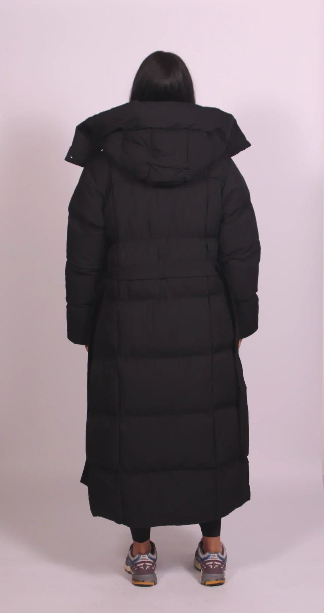 Women's oversized quilted longline puffer coat with hood and tie waist