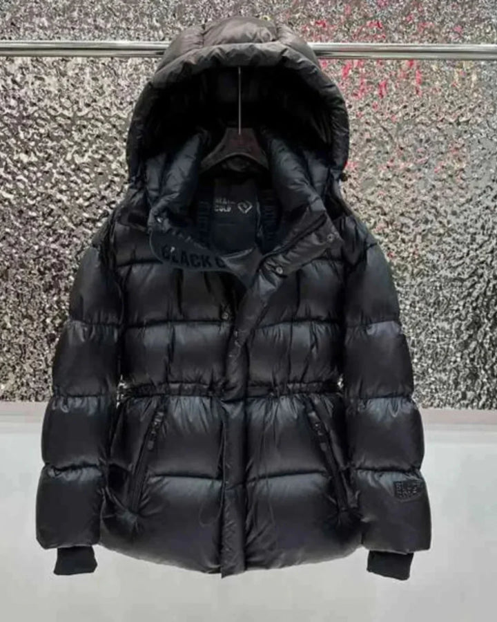 Women's black quilted hooded puffer jacket with adjustable waist and zip pockets